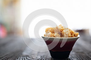 Homemade deep fried crispy pork rind in bowl