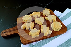 Homemade Delectable Cute Butter Cookies on Wooden Breadboard