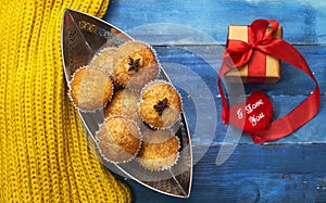 homemade delicious arabic muffins on boat shape with present for holiday concept.