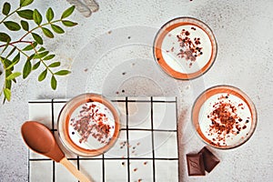 Homemade delicious chocolate mousse panna cotta pudding whipped cream in a glasses