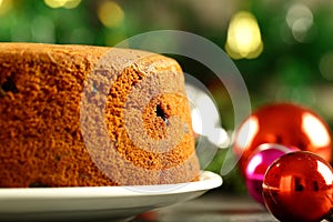 Homemade delicious plum cake on a Christmas background