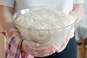 Homemade dough cooking baking, white hands female holding glass bowl