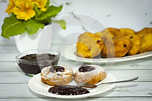 Homemade doughnut â€“ with castor sugar and plum jam