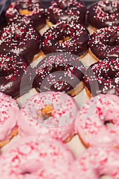 Homemade doughnuts with chocolate and strawberry icing