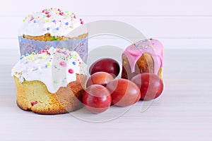 Homemade Easter cake and painted eggs on the table