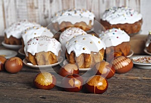 Homemade Easter cakes with eggs on a wooden background.The idea of preparing for the Easter holiday