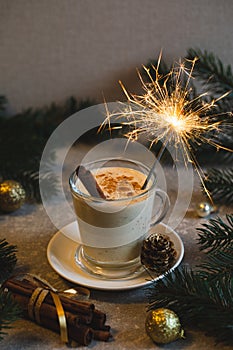 Homemade eggnog with grated nutmeg and cinnamon. Traditional Christmas drink