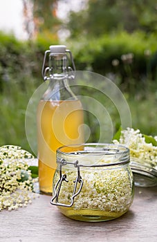 Homemade elderflower cordial syrup and lemonade.