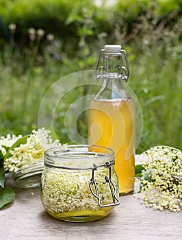 Homemade elderflower cordial syrup and lemonade.