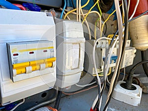 Homemade electric control cabinet for electronic devices at home with circuit breakers and counters in an iron box