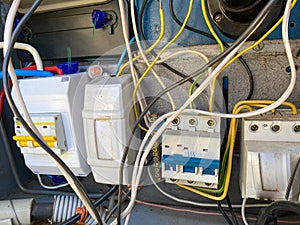 Homemade electric control cabinet for electronic devices at home with circuit breakers and counters in an iron box