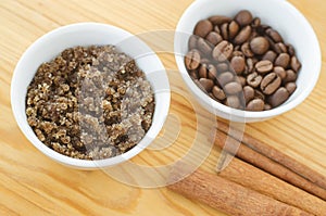 Homemade exfoliating foot and body aroma scrub with ground coffee, sugar, cinnamon and olive oil. Natural beauty treatment