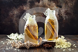 Homemade fermented cinnamon and ginger kombucha tea infused with elderflower. Healthy natural probiotic flavored drink.