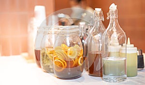 Homemade fermented raw kombucha tea with different flavorings, as  lemon organic probiotic drink photo
