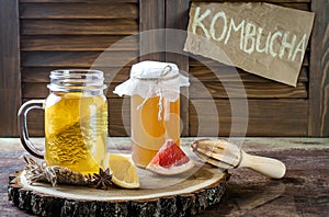 Homemade fermented raw kombucha tea with different flavorings. Healthy natural probiotic flavored drink. Copy space.