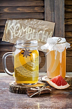 Homemade fermented raw kombucha tea with different flavorings. Healthy natural probiotic flavored drink. Copy space.