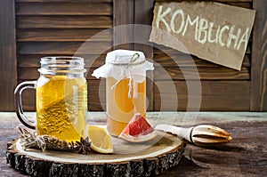 Homemade fermented raw kombucha tea with different flavorings. Healthy natural probiotic flavored drink. Copy space.