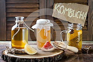 Homemade fermented raw kombucha tea with different flavorings. Healthy natural probiotic flavored drink. Copy space.