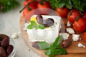 homemade feta cheese with olive oil, tomatoes and basil