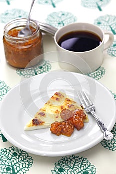 Homemade finnish squeaky cheese with cloudberry jam and coffee