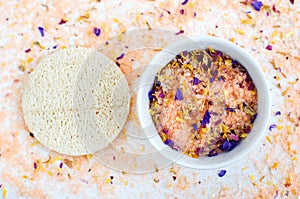 Homemade floral bath salts foot soak, fizzies, exfoliation scrub with dead sea salt, essential oil and dry flower petals photo