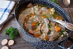 Homemade fresh cooked fortifying chicken soup in a pot