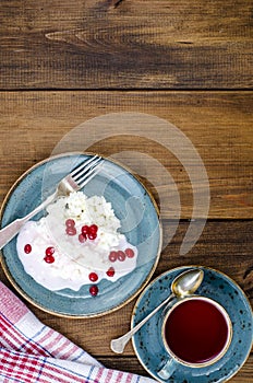 Homemade fresh cottage cheese with yogurt and red berries, tea