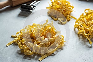 Homemade fresh pasta on a gray background. Close up