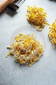 Homemade fresh pasta on a gray background. Close up