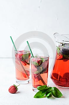 Homemade fresh strawberry lemonade with basil leaves