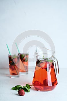 Homemade fresh strawberry lemonade with basil leaves