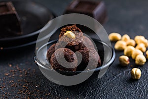 Homemade fresh truffle dark chocolate candies with cocoa powder made by chocolatier. Gourmet food, delicious dessert