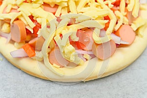 a homemade fresh uncook pizza close up