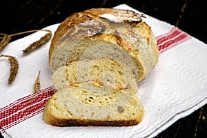 Homemade freshly baked bread on a napkin. Sliced â€‹â€‹bread