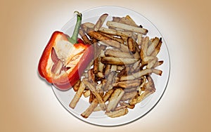 Homemade fried potatoes on a plate, pepper