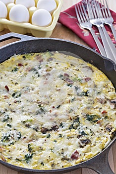 Homemade frittata made with broccoli, bacon, spinach and mushrooms