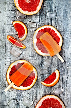 Homemade frozen grapefruit natural juice popsicles.