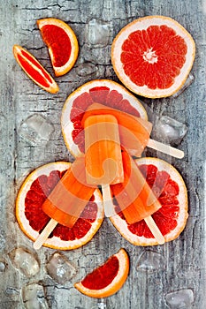 Homemade frozen grapefruit natural juice popsicles.