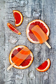 Homemade frozen grapefruit natural juice popsicles.