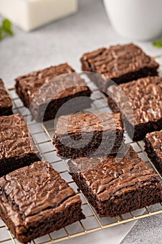 Homemade fudgy brownies on a baking rack photo