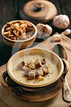 Homemade garlic cream soup with croutons.