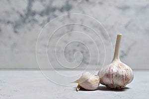 homemade garlic from a vegetable garden on a gray concrete background