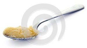 Closeup of Homemade Ghee or clarified butter in a spoon photo