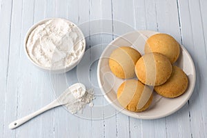 Homemade gluten free cottage cheese rice cookies and bowl rice flour on light background