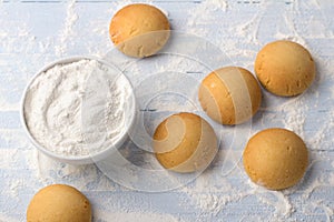 Homemade gluten free cottage cheese rice cookies and bowl rice flour on light background