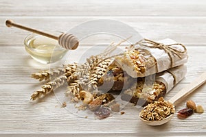 Homemade gluten free granola bars on wooden background.