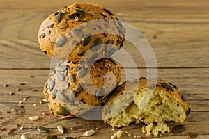 Homemade Gluten-free vegan pumpkin scones with seeds on wooden table