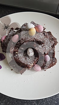 Homemade gooey chocolate brownies with mini egg decoration