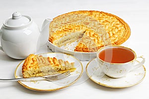 Homemade gooseberry lemon pie and cup of tea