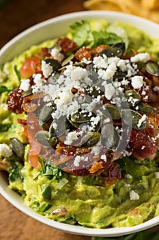 Homemade Gourmet Fancy Guacamole with Toppings photo